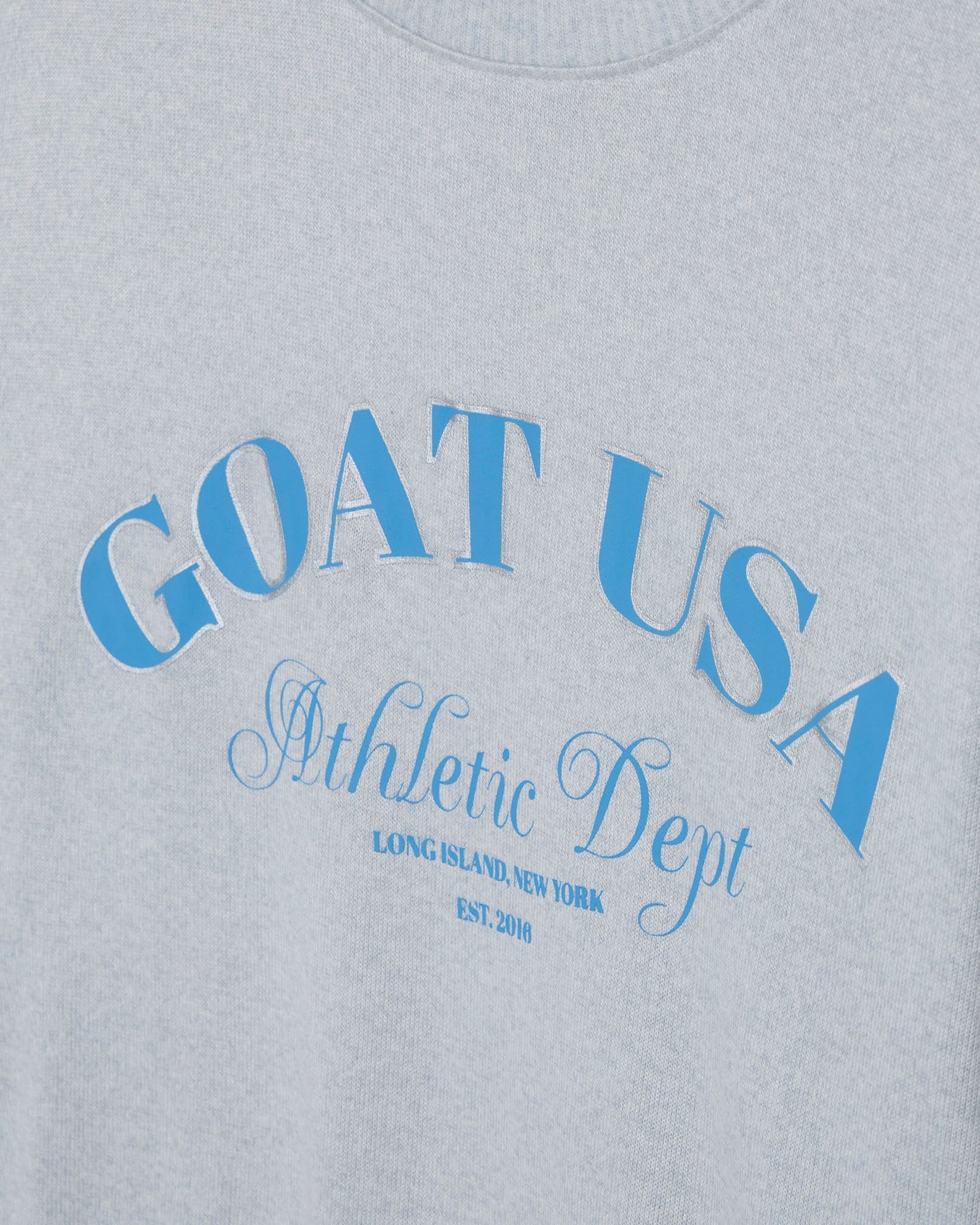 Gray sweatshirt with blue 'GOAT USA Athletic Dept' text on a gray background