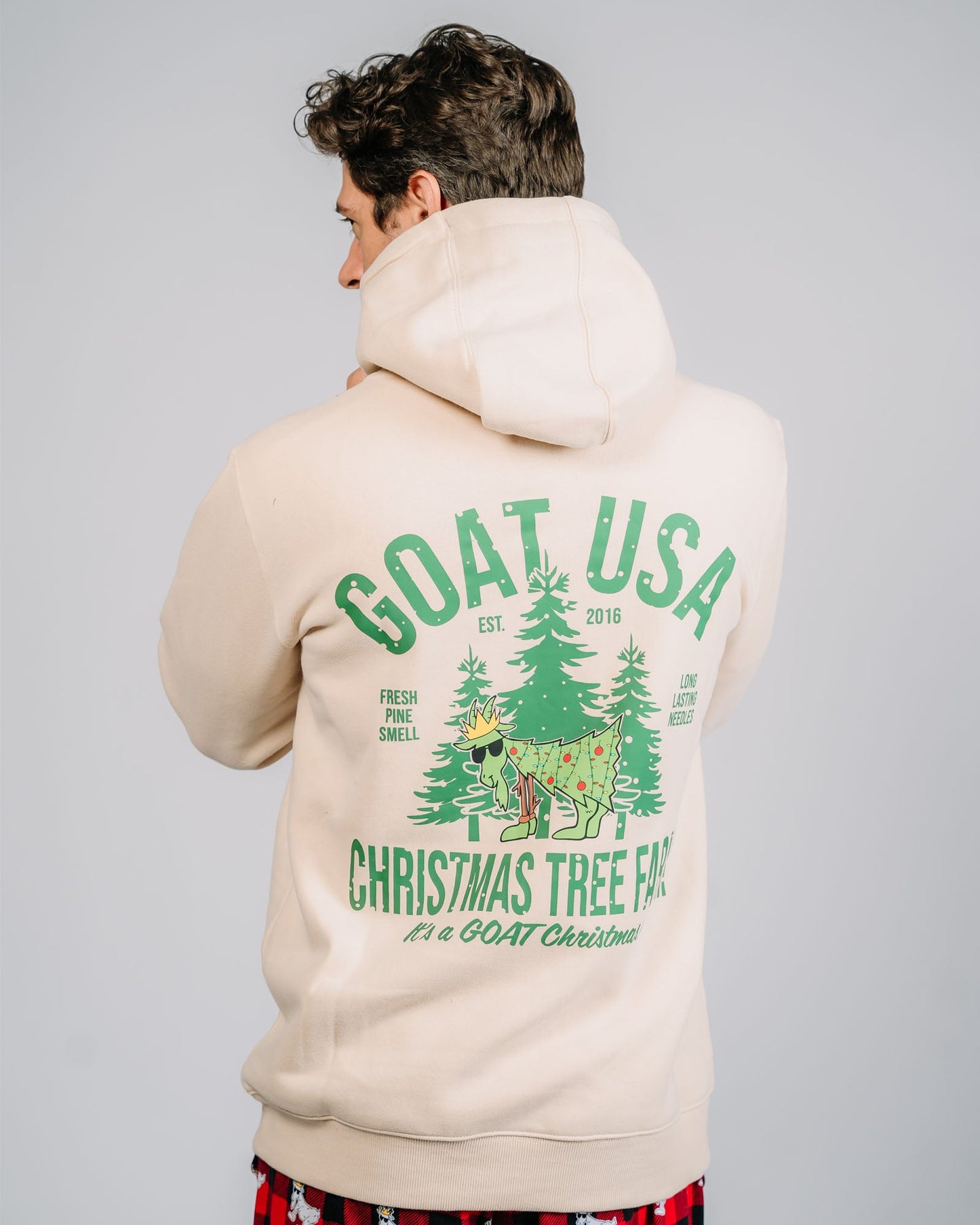 Back of Christmas tree farm goat hoodie on model