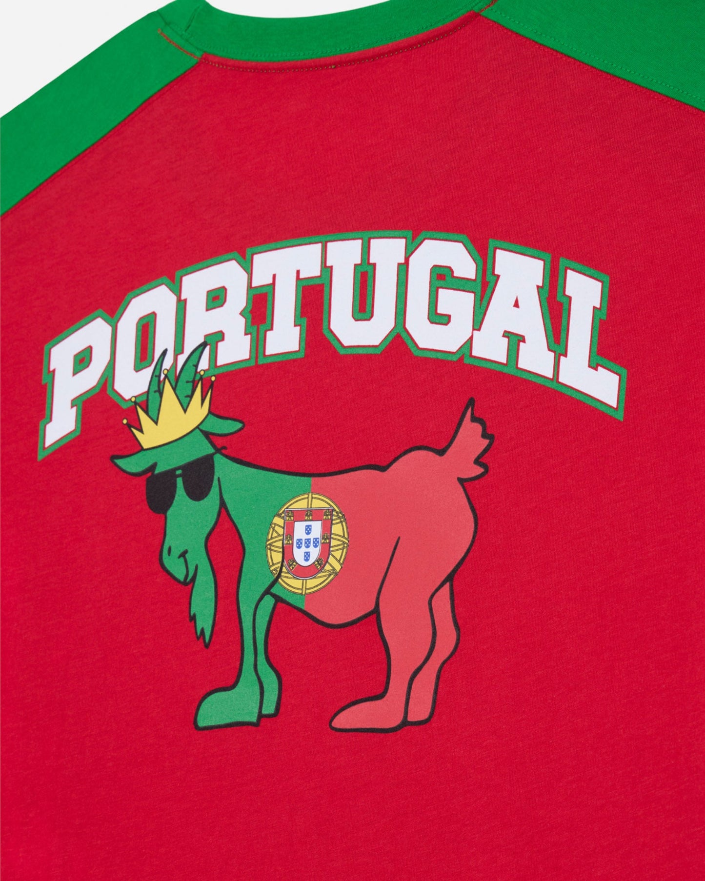 Red shirt with green sleeves featuring a goat logo and 'Portugal' text on a red background