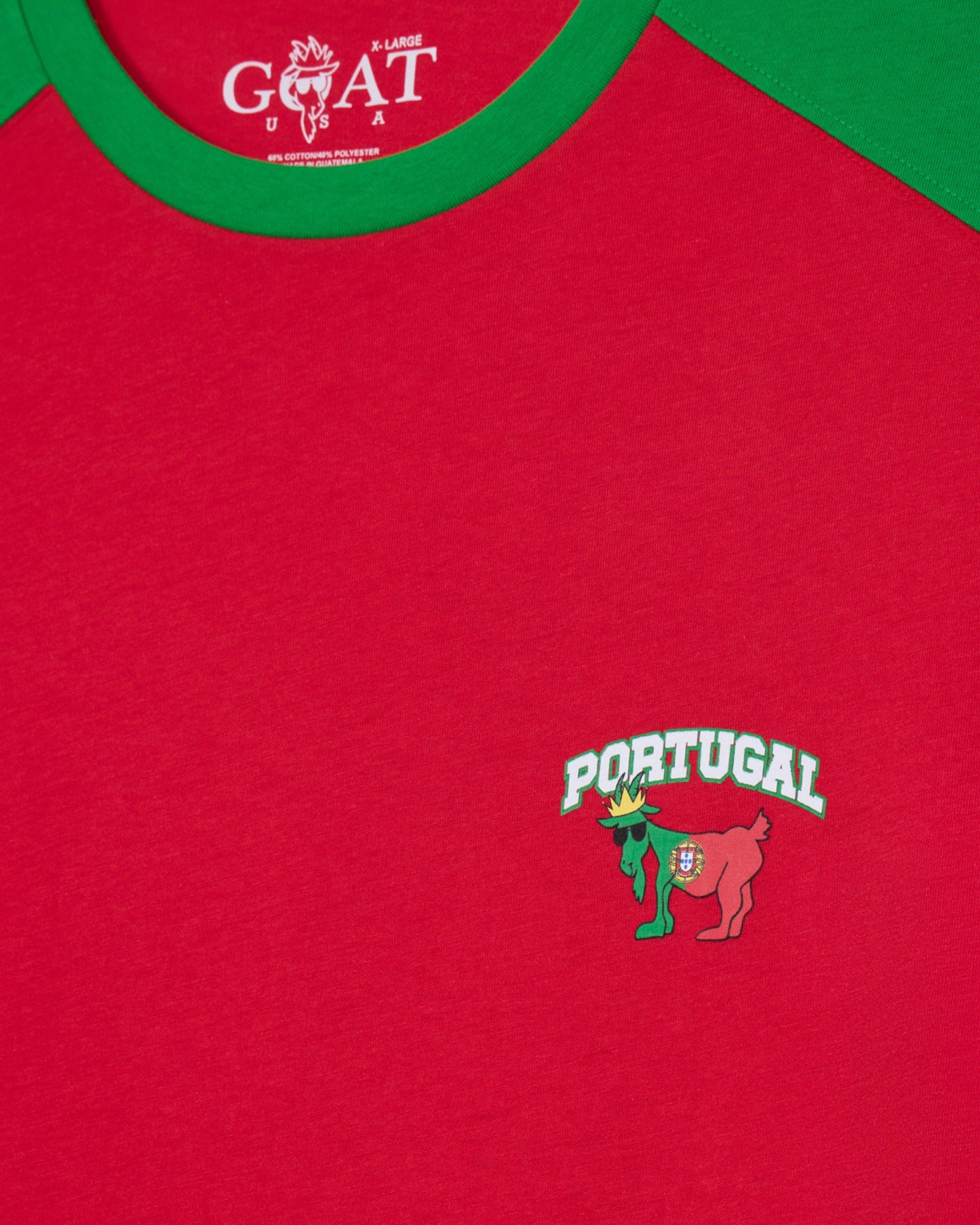 Red shirt with 'Portugal' logo and green collar, featuring a brand logo at the top.