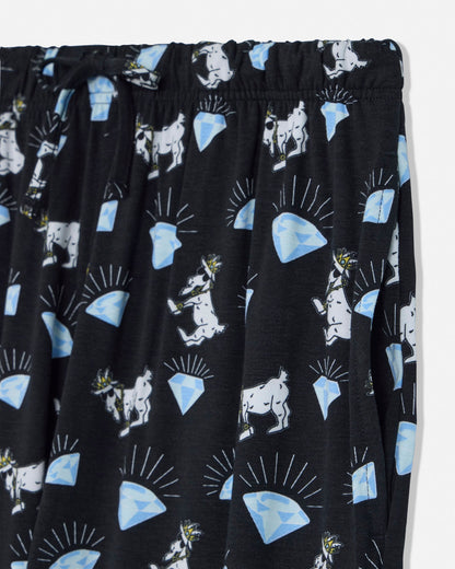 Black pants with white goat and blue diamond pattern on a white background