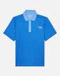 Blue patterned polo shirt with a small logo on a light gray background