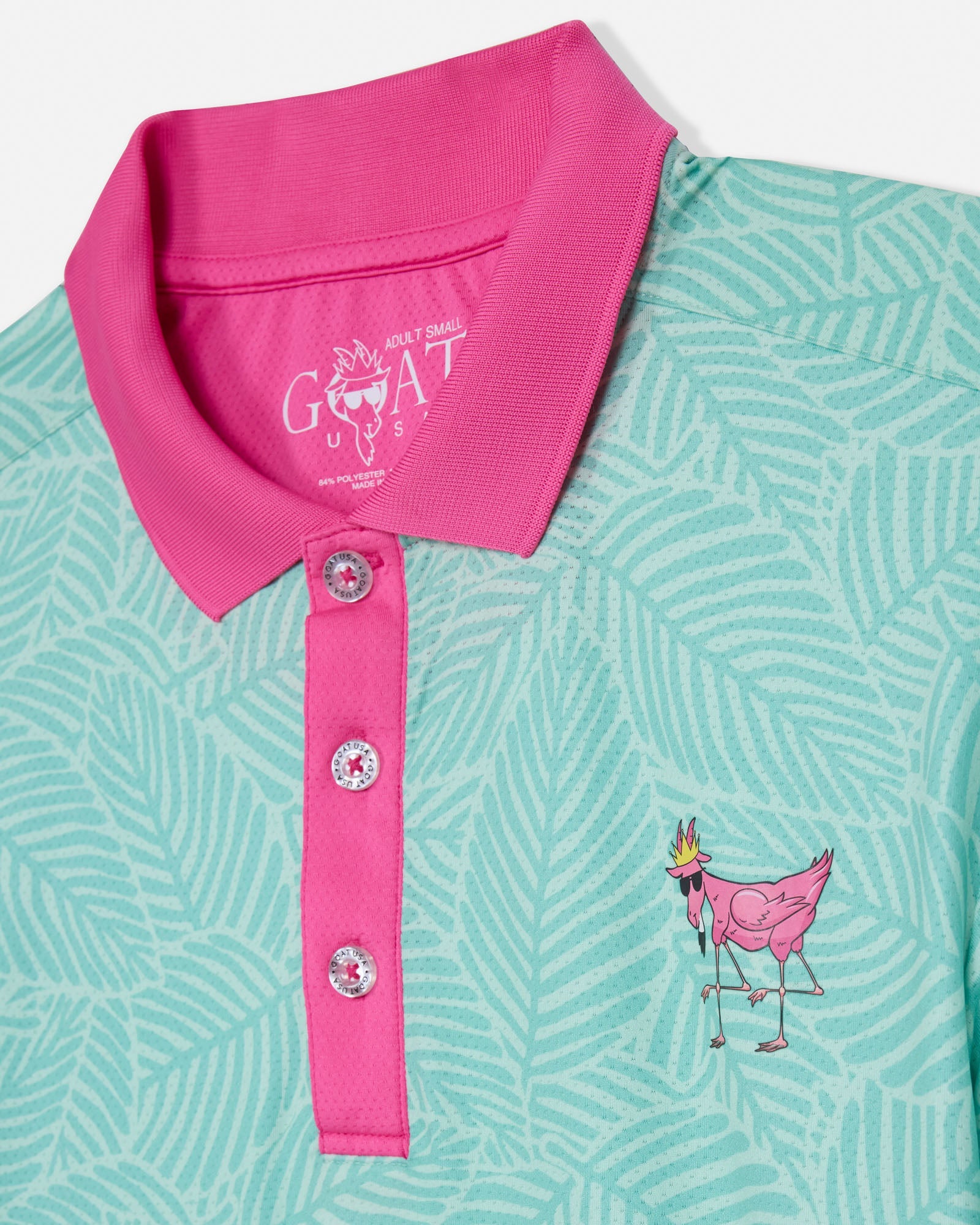 Mint green polo shirt with pink collar and goat graphic on a white background