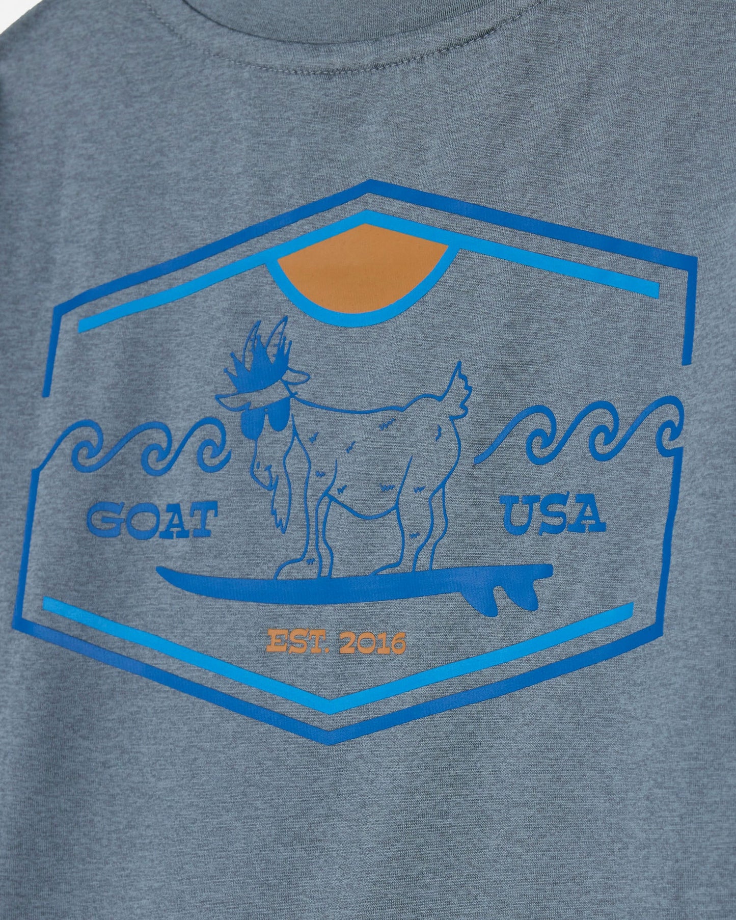Gray t-shirt with a blue and orange graphic of a goat and 'GOAT USA' text on a gray background#color_gray