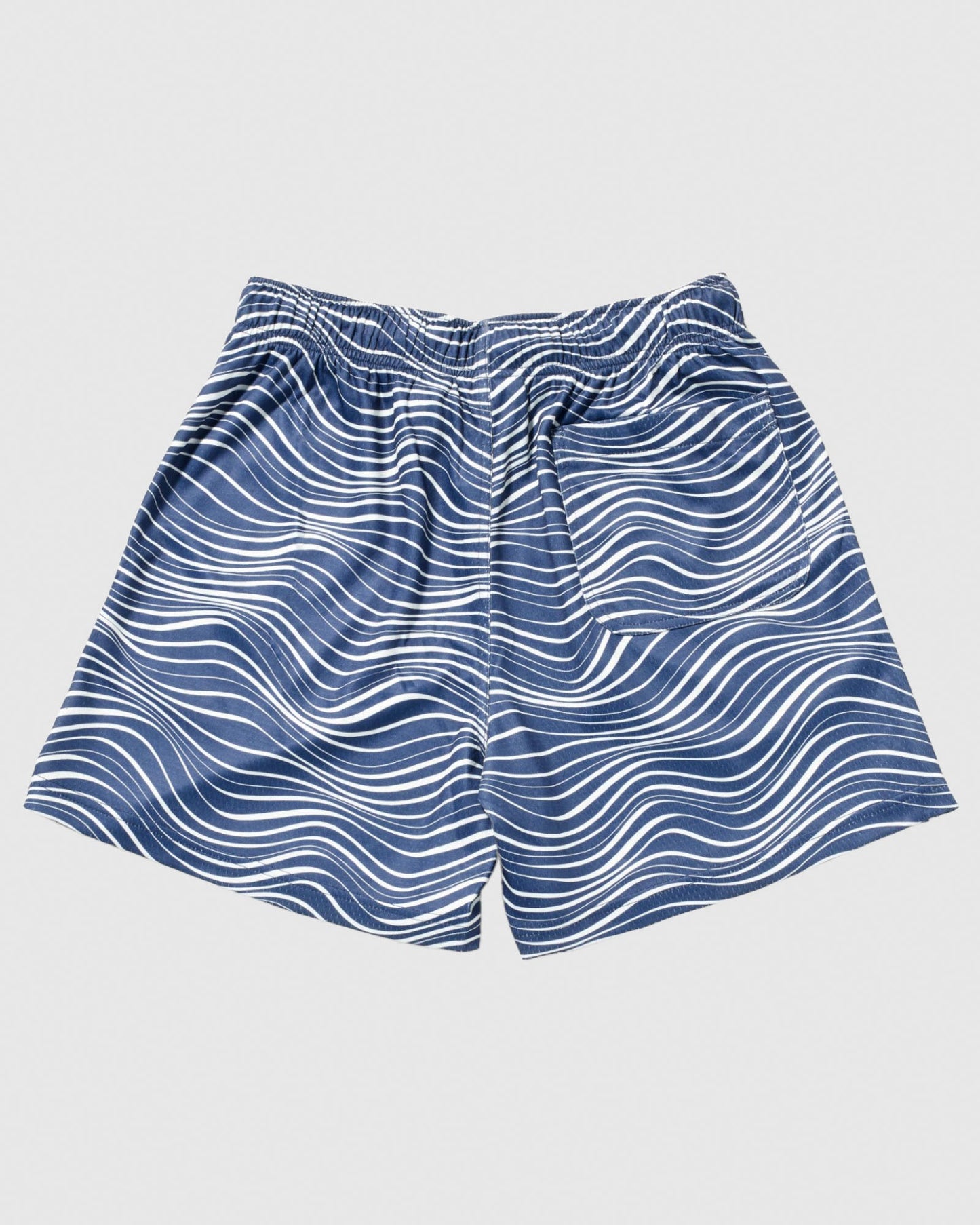 Back of navy mesh shorts with wave design#color_navy