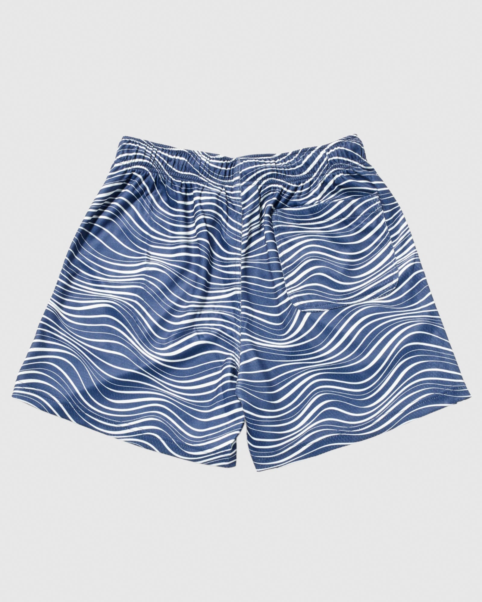 Back of navy mesh shorts with wave design#color_navy