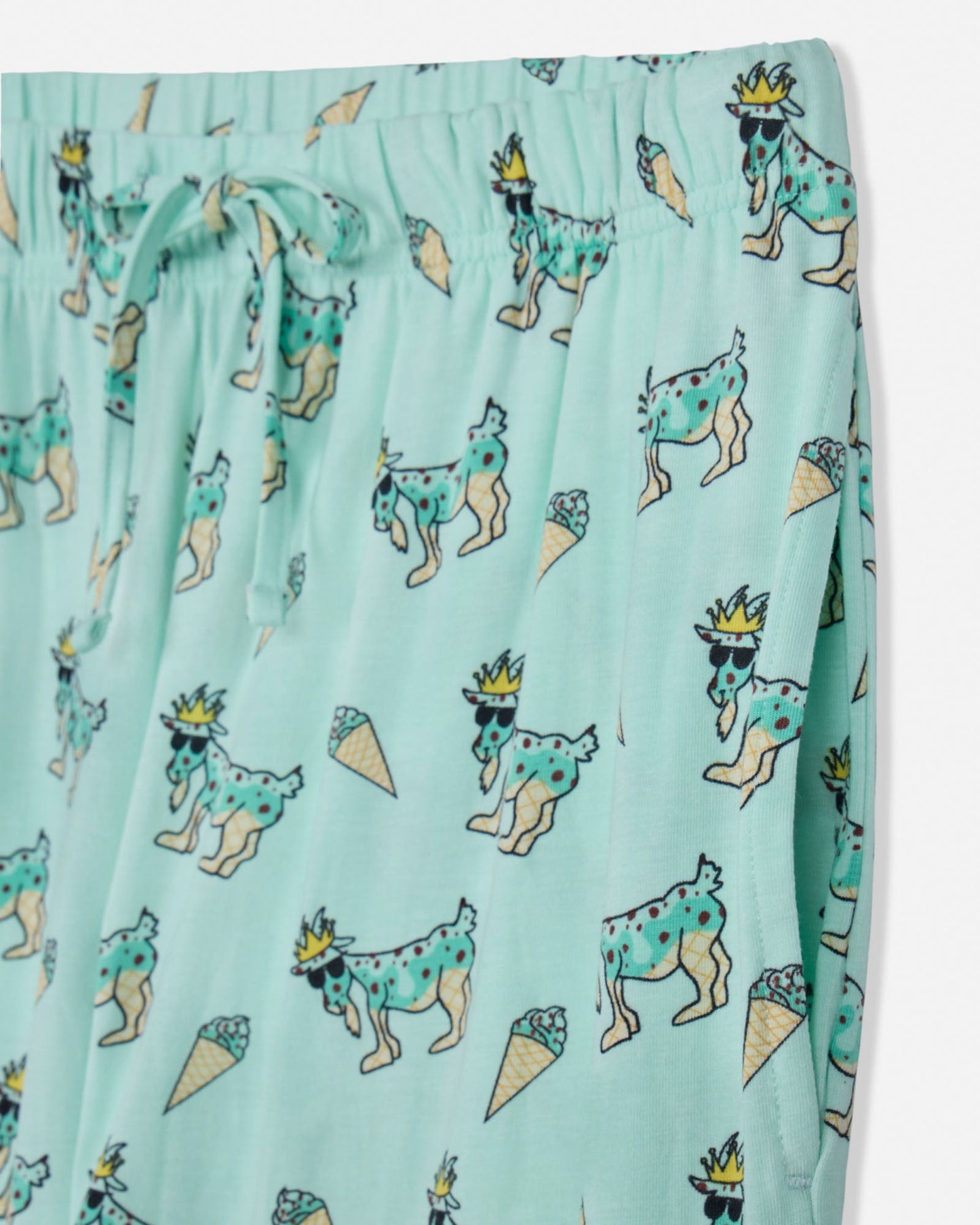 Light green fabric with cartoon goat and ice cream pattern