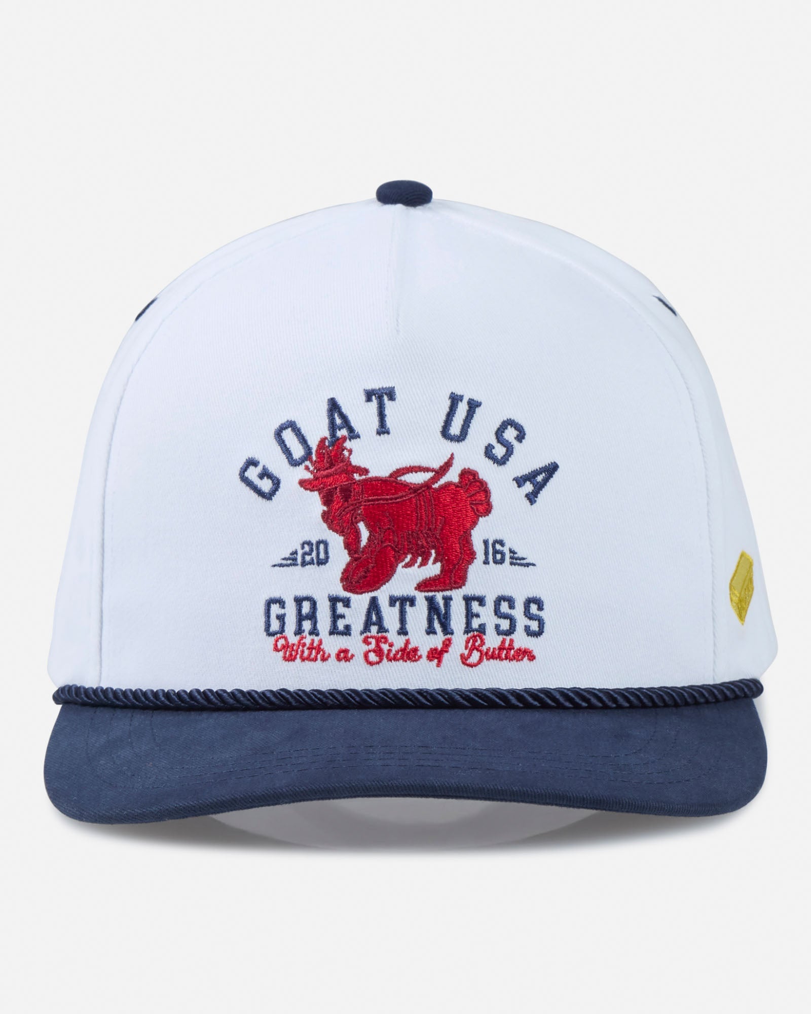White and navy cap with red graphic and text on a light gray background