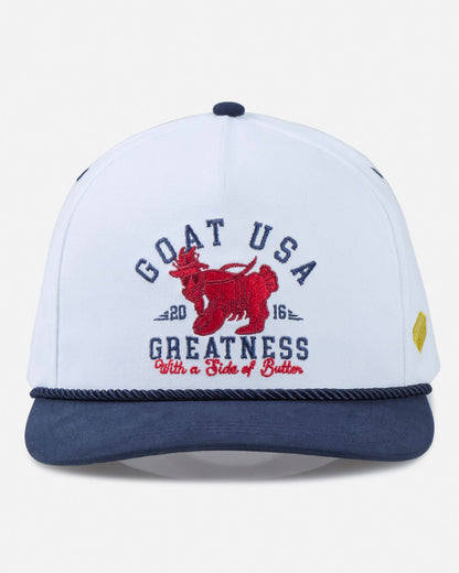 White and navy cap with red graphic and text on a light gray background