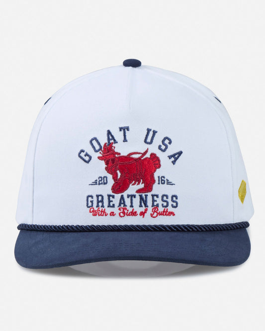 White and navy cap with red graphic and text on a light gray background