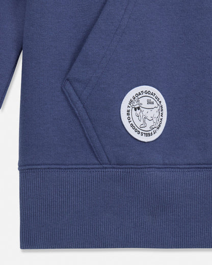 Close-up of a blue hoodie with a white logo on a white background