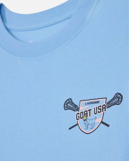Close-up of blue crop top with lacrosse goat left-chest logo