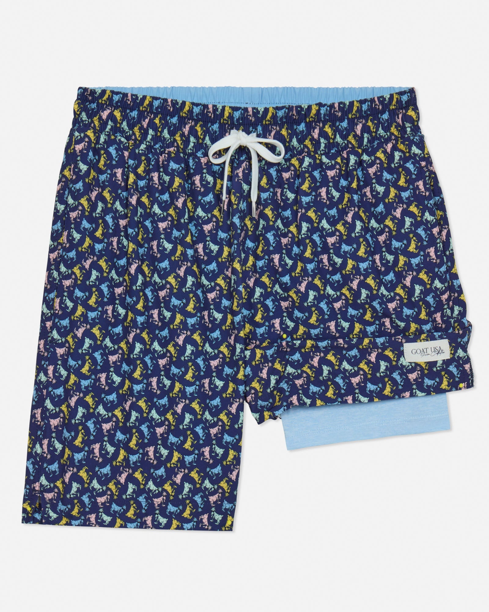 Navy swim shorts with colorful goat pattern on a light gray background