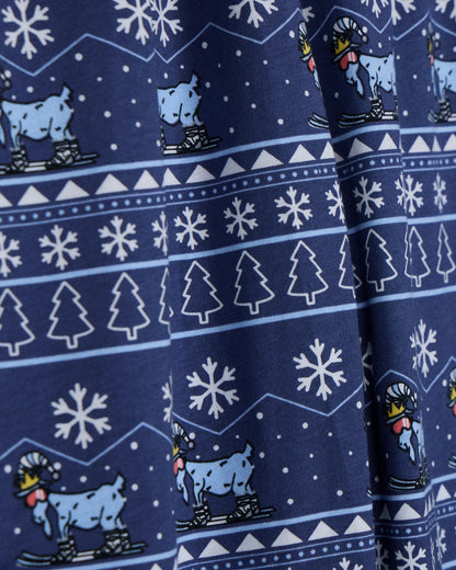Navy blue fabric with white snowflakes, trees, and blue animals on skis pattern