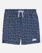Navy swim shorts with colorful goat pattern on a light gray background