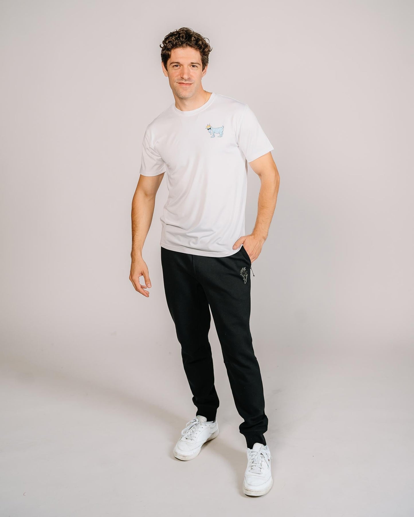 Male model wearing black performance joggers#color_black