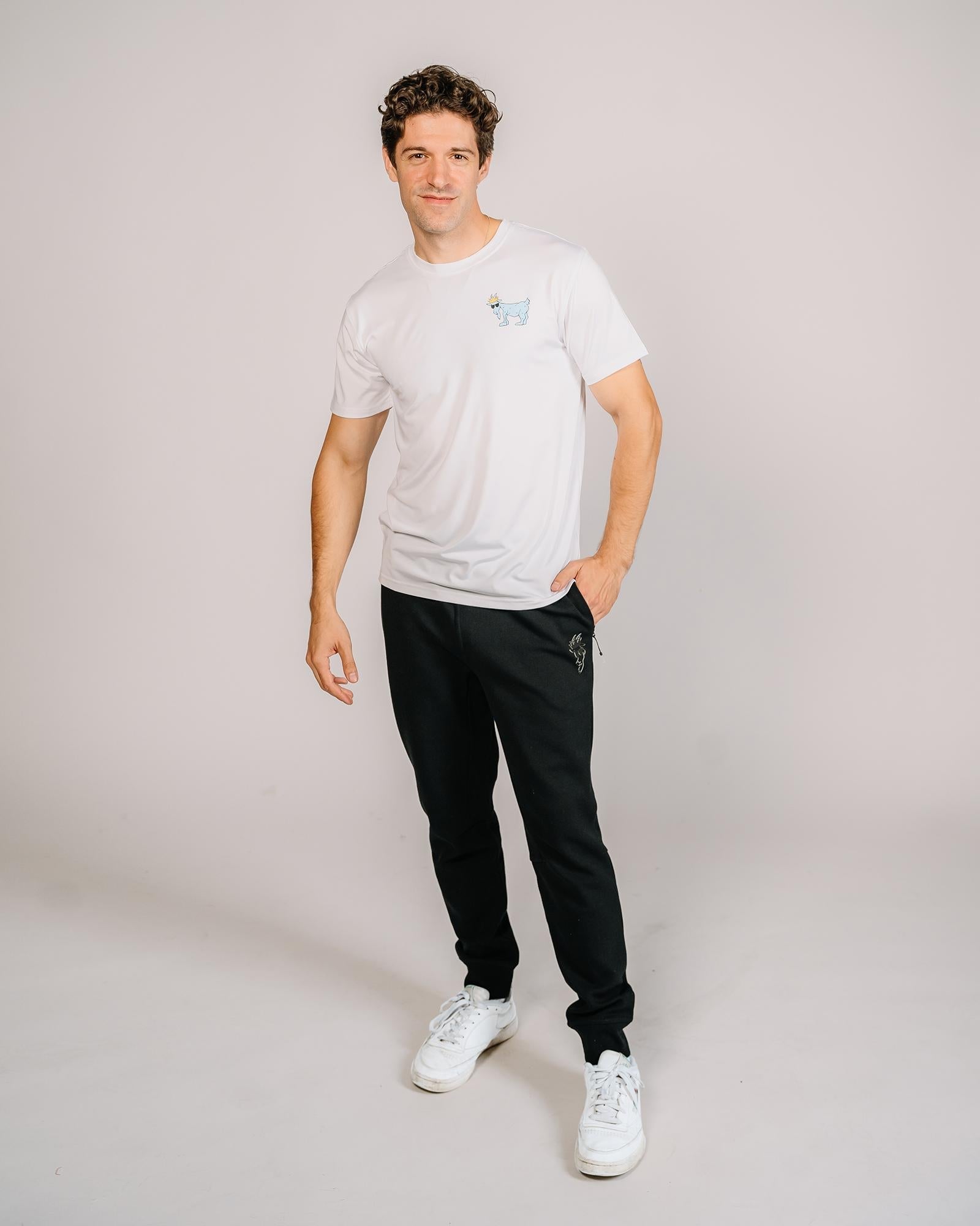 Male model wearing black performance joggers#color_black