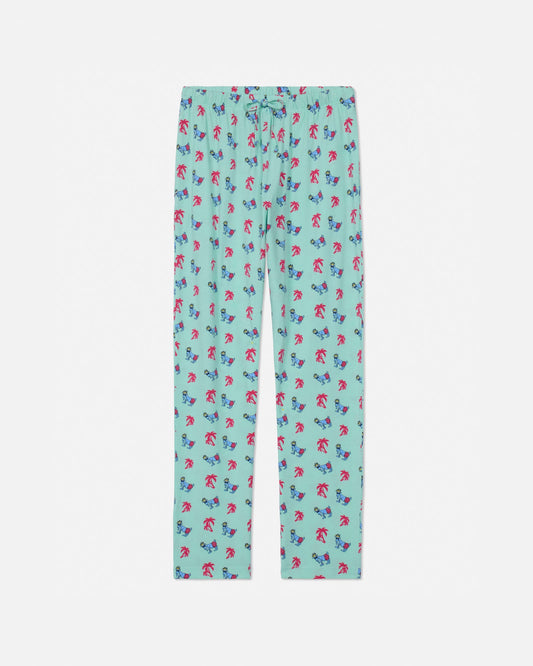 Palm tree-patterned pajama pants on a white background
