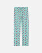 Palm tree-patterned pajama pants on a white background