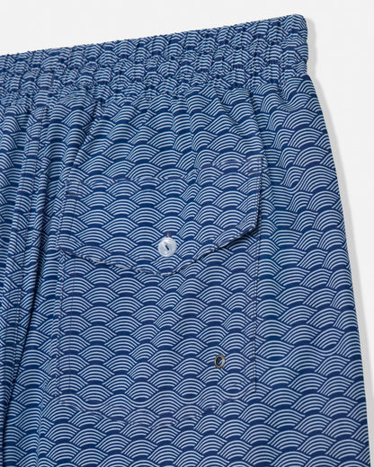 Blue patterned shorts with a pocket on a white background