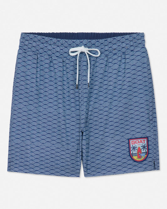 Blue patterned shorts with a logo on a white background