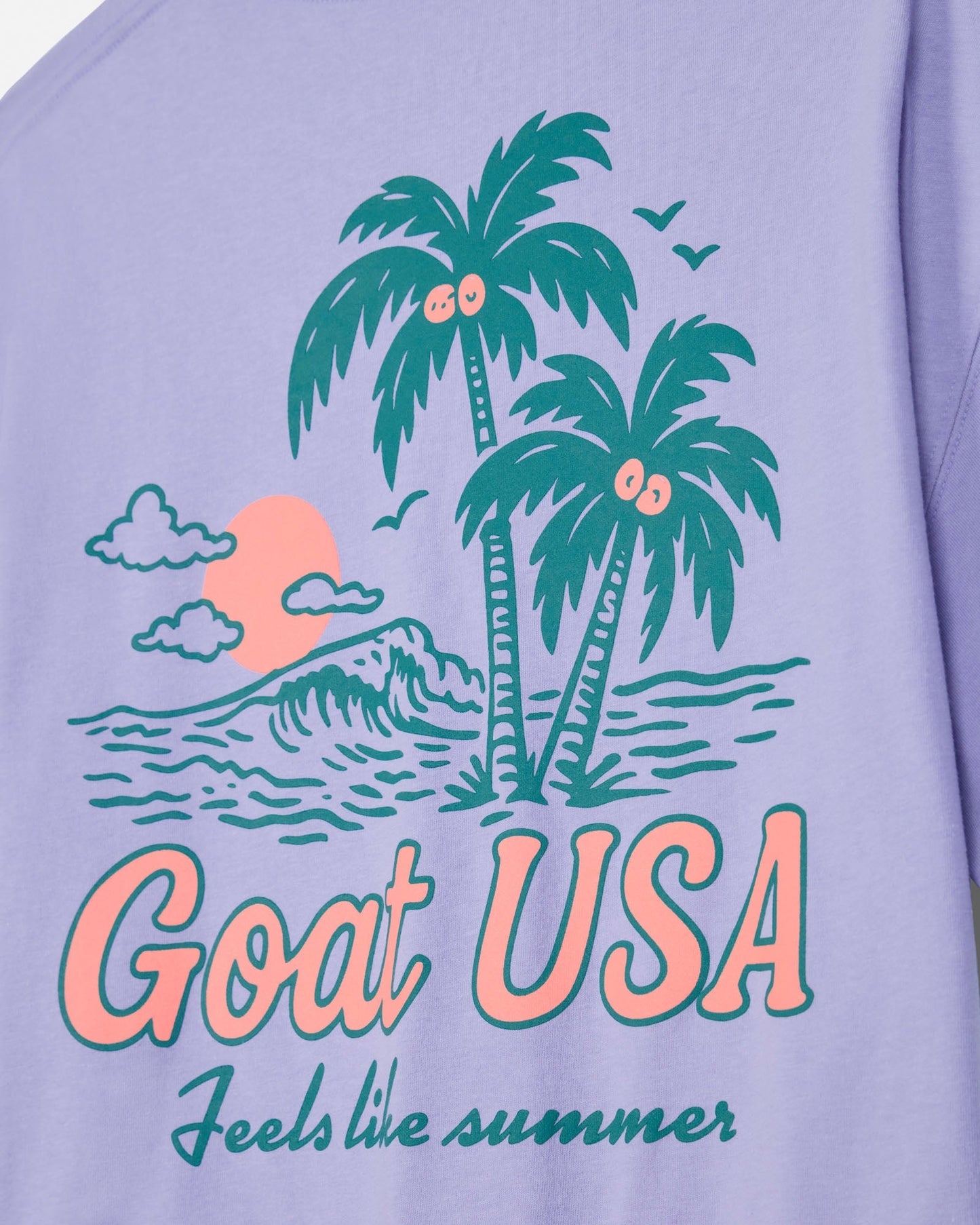 Periwinkle crop tee with 'Goat USA' and beach graphic design