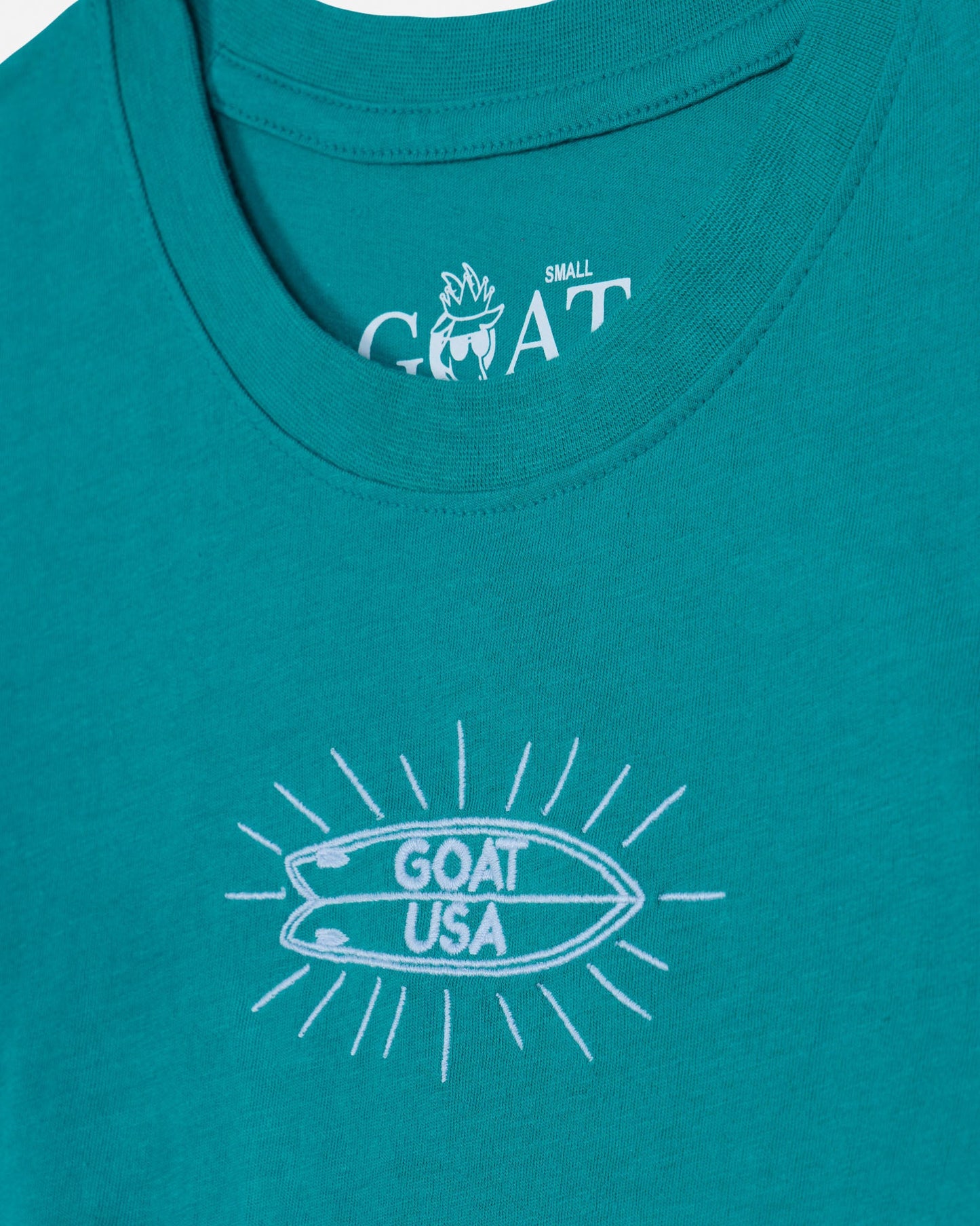 Teal tank top with white graphic and 'GOAT USA' text