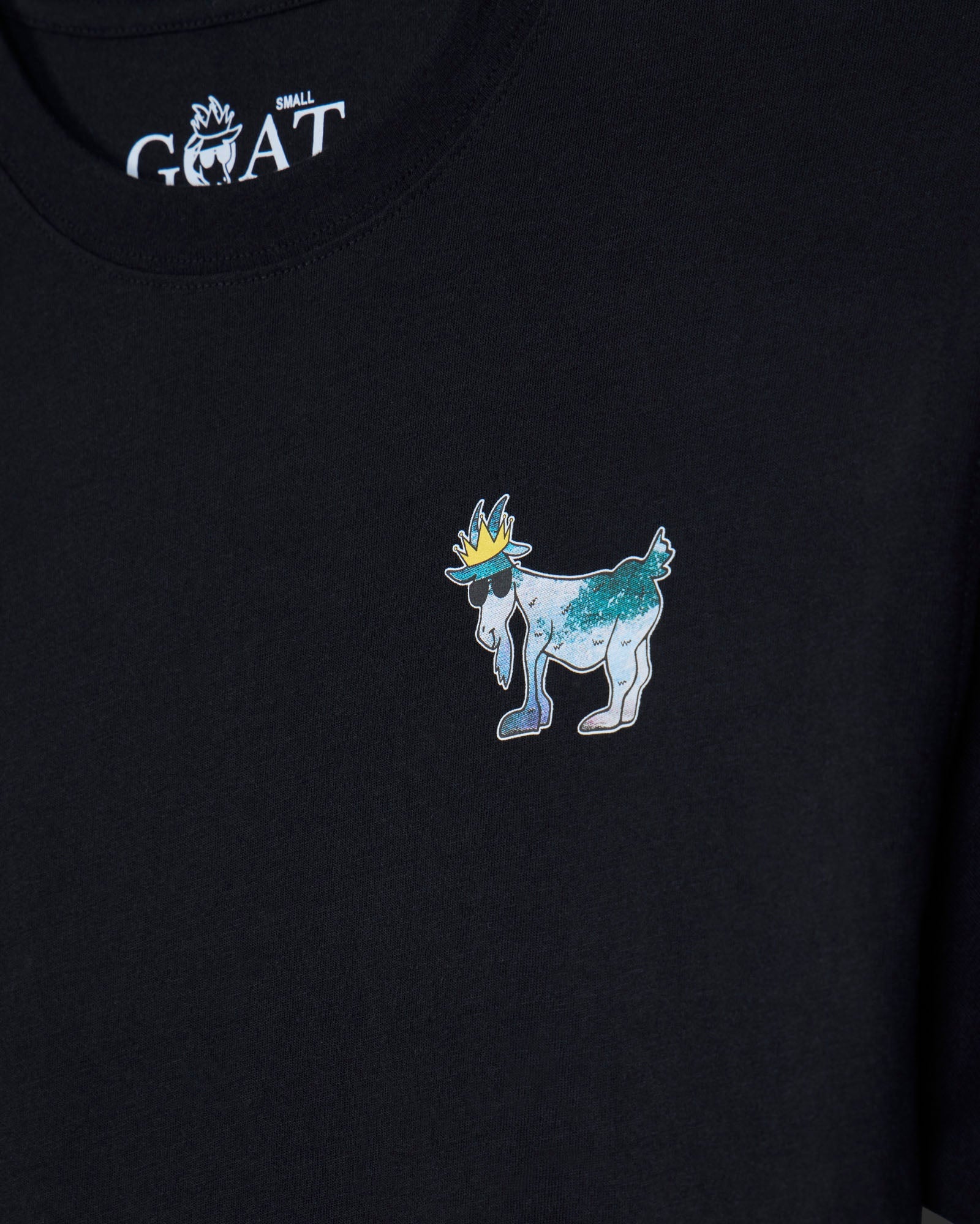 Black t-shirt with a colorful embroidered design of a goat wearing a crown on a dark background.