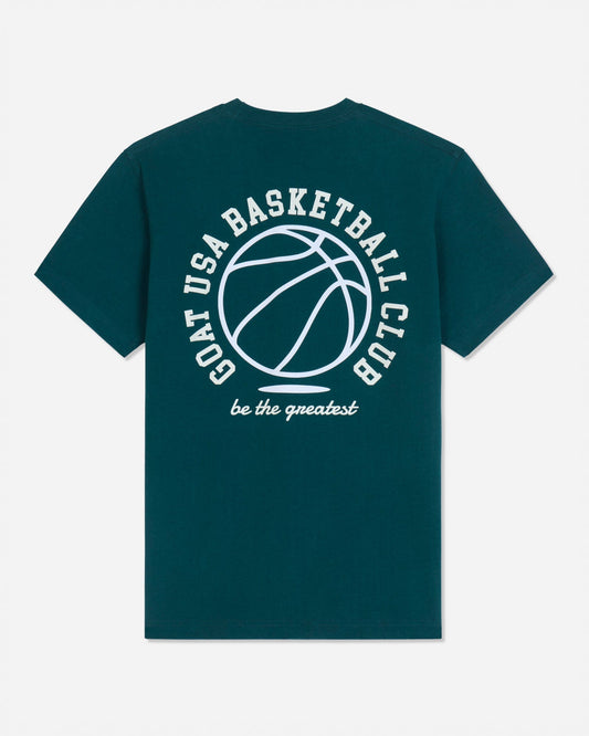 A dark teal green short-sleeve t-shirt with a white graphic print on the back featuring a basketball and the text 'GOAT USA BASKETBALL CLUB' and 'be the greatest'.