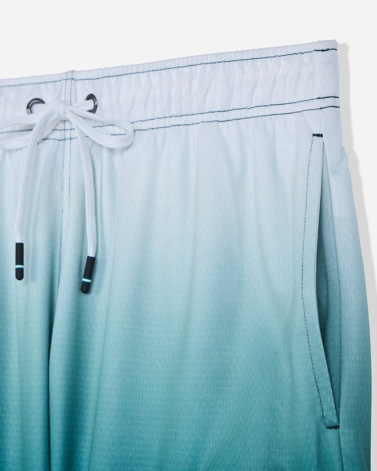 Close-up of pocket on sage fade mesh shorts#color_sage