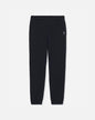 Black sweatpants with an elastic waistband and cuffs, featuring a small embroidered logo on the left hip, displayed against a light gray background.#color_black