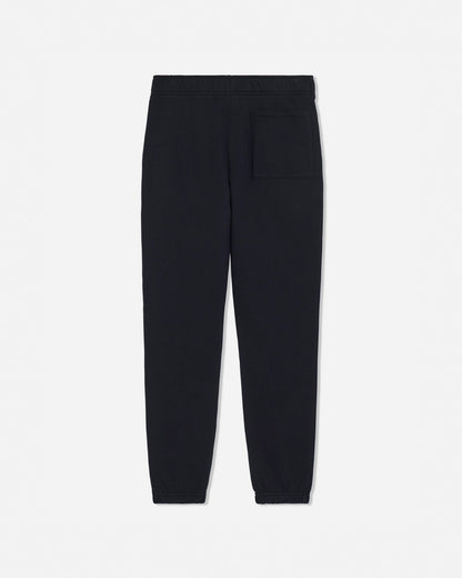 Black jogger pants with a single welt pocket on the back right, shown flat against a light gray background.#color_black