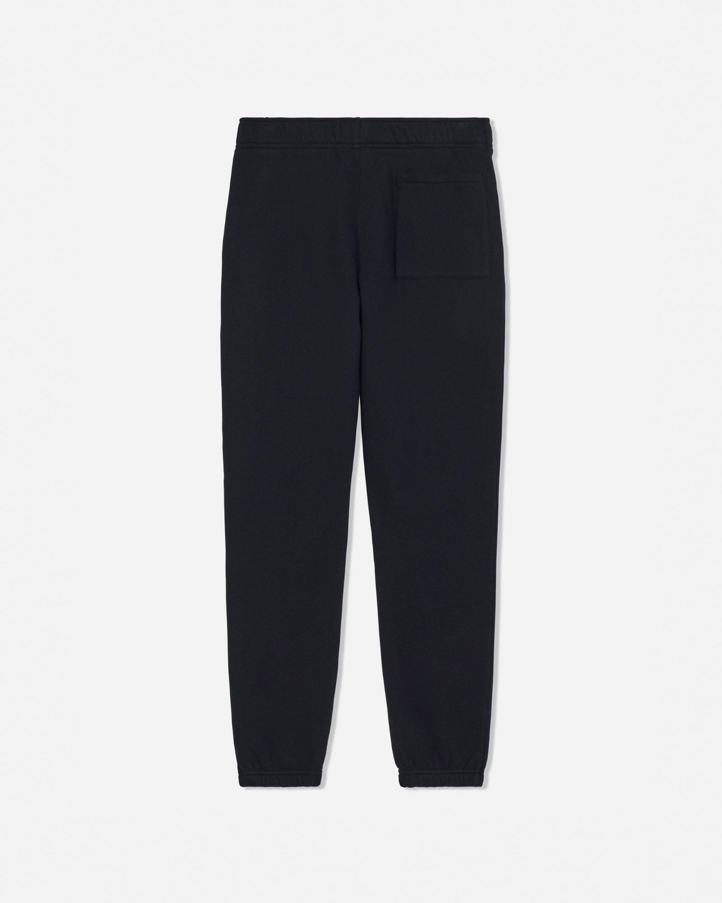 Black jogger pants with a single welt pocket on the back right, shown flat against a light gray background.#color_black