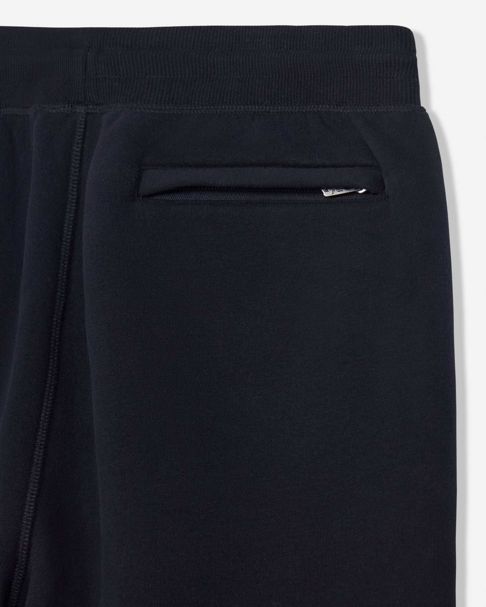 Close-up of a black sweatpants with a white background