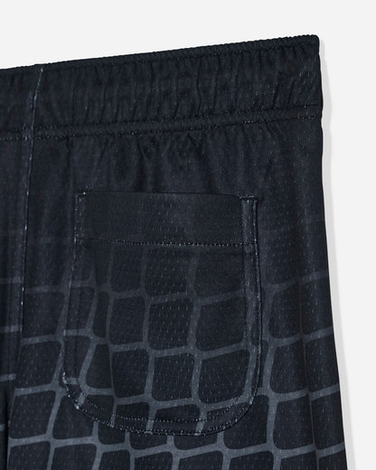 Close-up of back pocket on black mesh shorts with a hockey net pattern