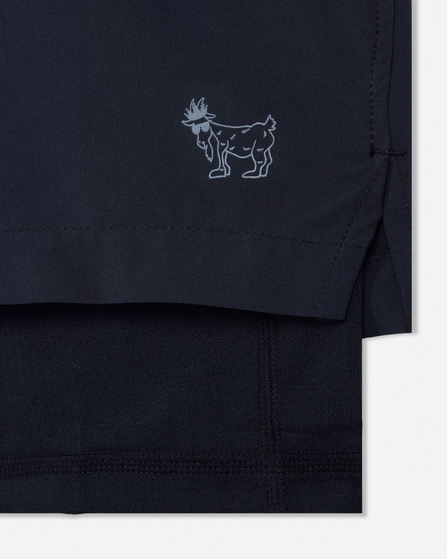 Black shorts with a small logo on a white background#color_black