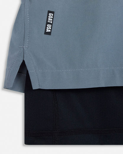 Close-up of a gray shirt with a black logo on a white background#color_storm-gray