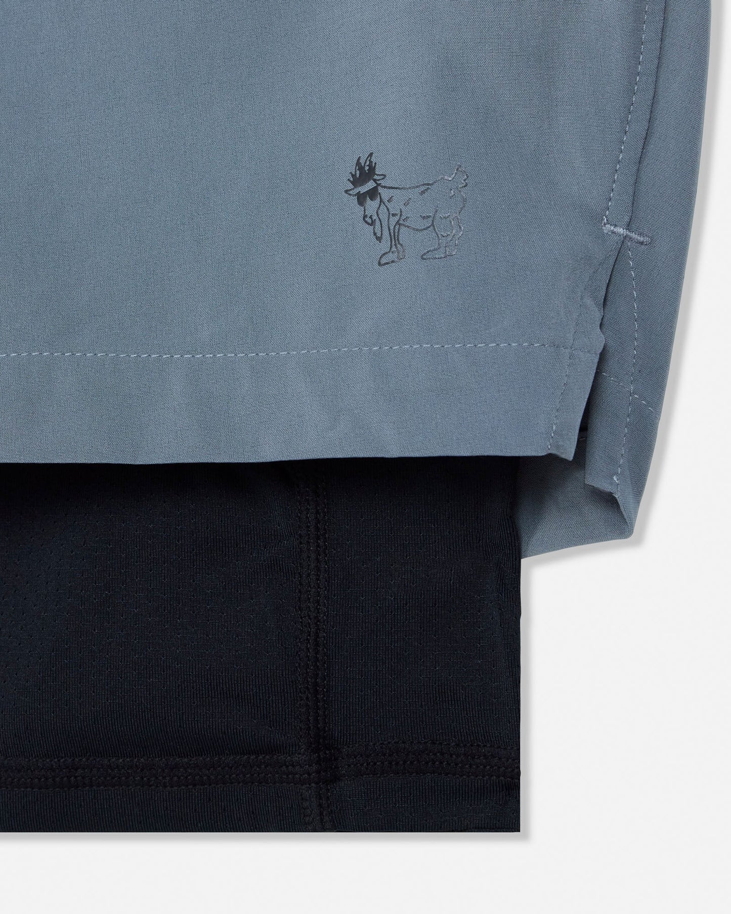 Close-up of a gray garment with a logo on a white background#color_storm-gray