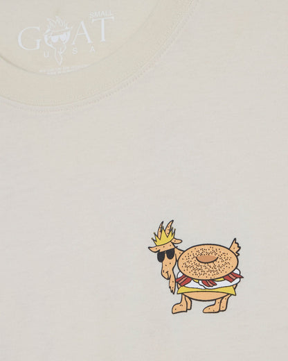 Cartoon character with a crown and hat on a beige t-shirt