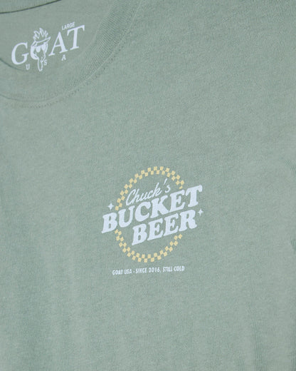'Chuck's Bucket Beer' left-chest graphic on steeped sage t-shirt