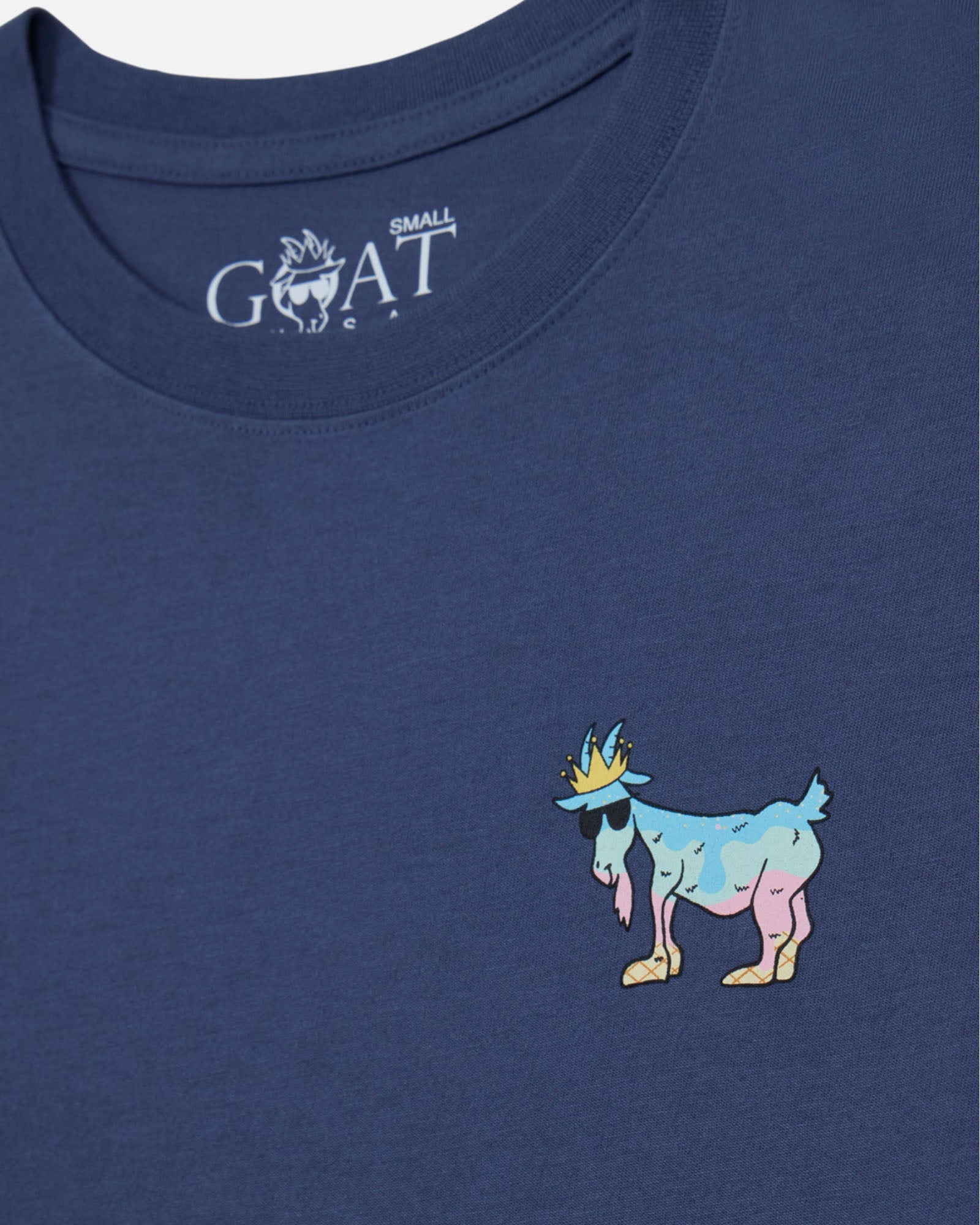 Blue t-shirt with a colorful goat graphic and 'GOAT' logo on a blue background