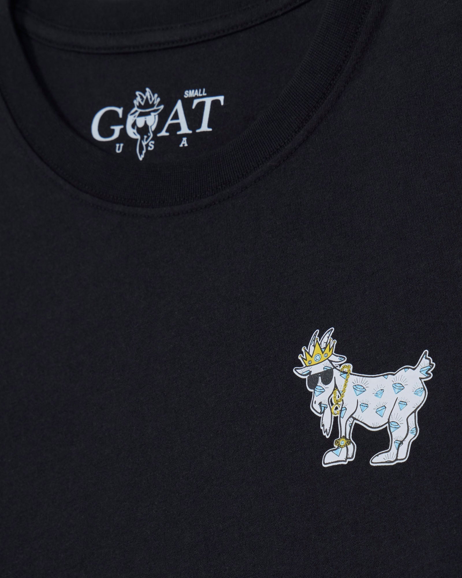 Black t-shirt with embroidered goat design and 'GOAT' logo on a black background
