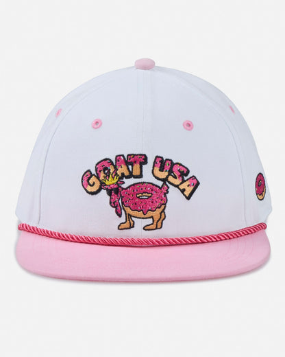 White and pink cap with 'GOAT USA' design on a light gray background