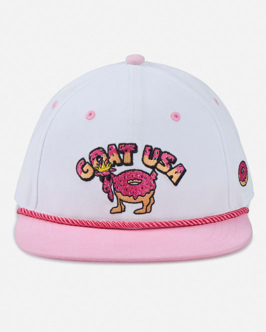 White and pink cap with 'GOAT USA' design on a light gray background