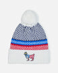 Knitted beanie with a colorful pattern and embroidered design on a white background