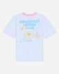 White oversized t-shirt that says 'Breakfast Lovers Club' with various breakfast items