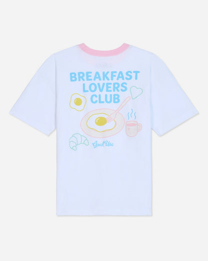 White oversized t-shirt that says 'Breakfast Lovers Club' with various breakfast items