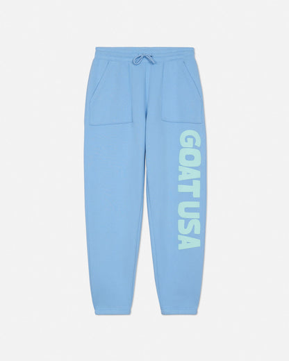 Light blue sweatpants with 'GOAT USA' text on a light gray background#color_carolina-blue