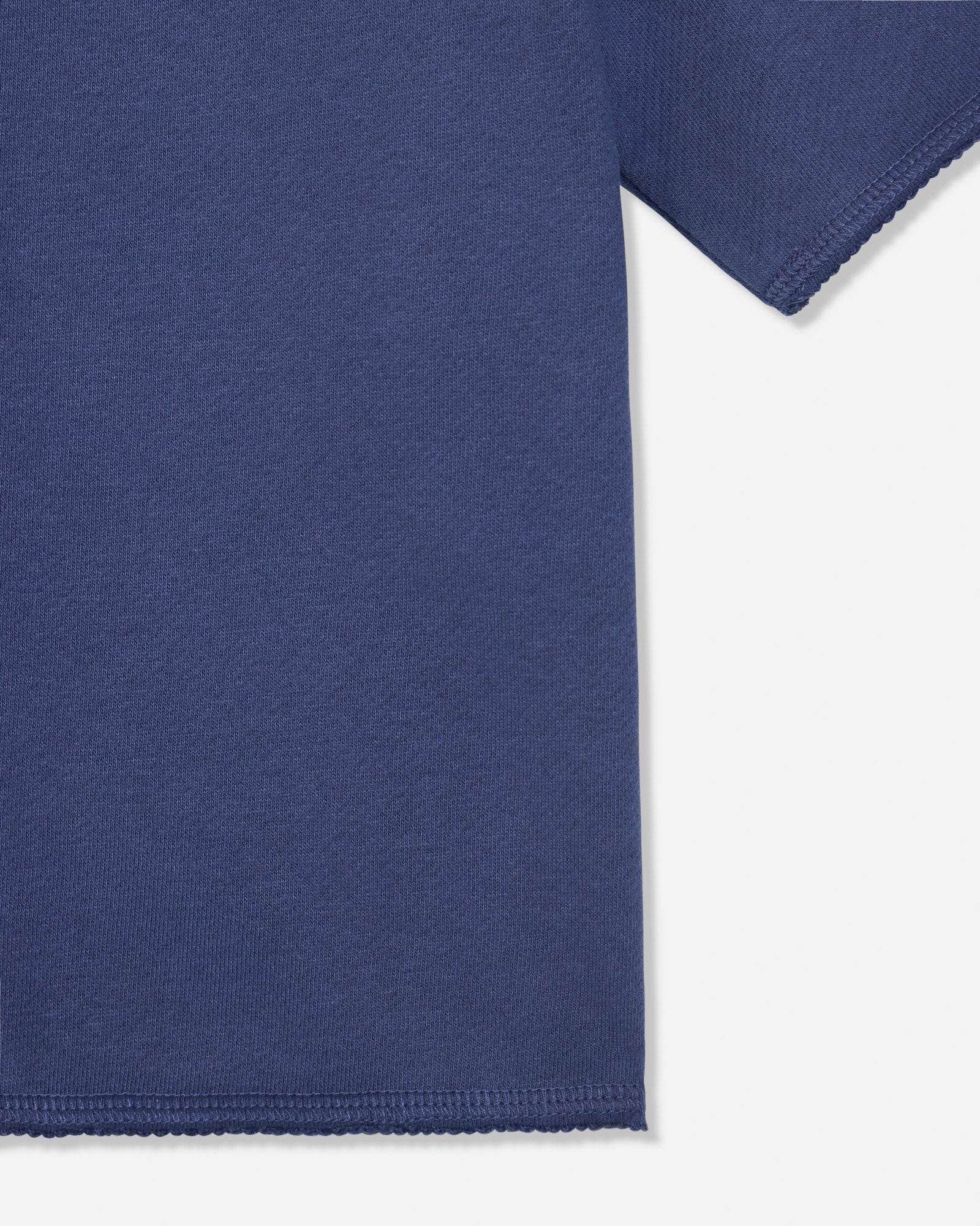 Close-up of hem on navy french terry tee#color_navy