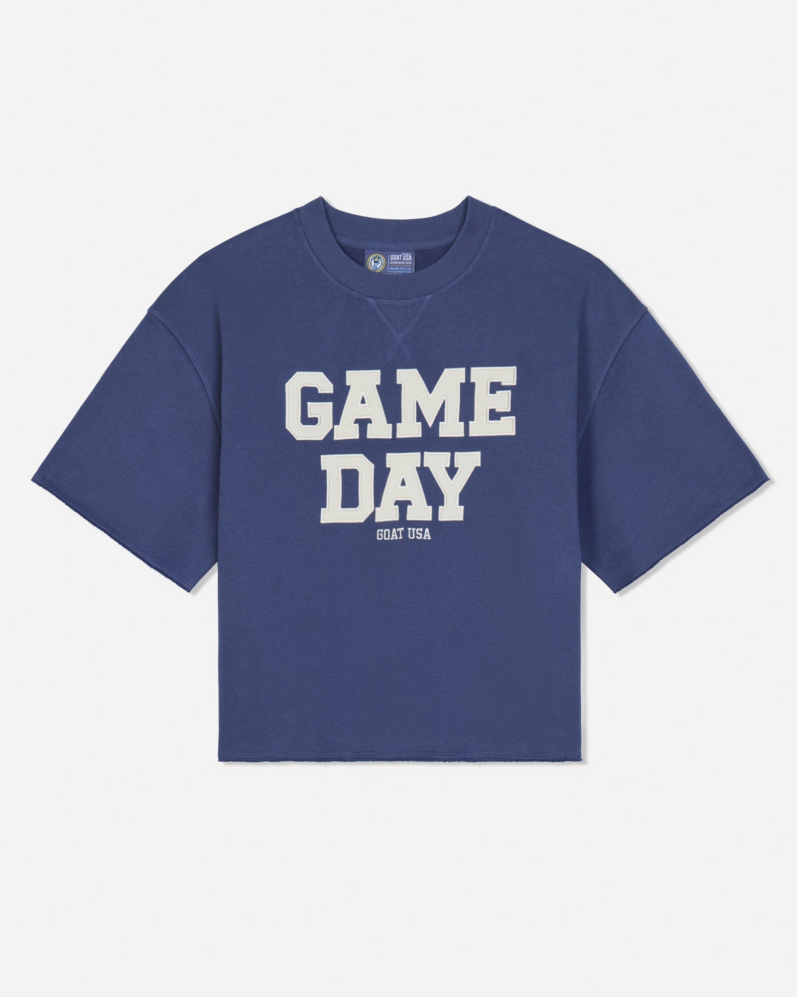 A blue short-sleeve french terry t-shirt with 'GAME DAY' printed in bold white block letters on the front, with 'GOAT USA' printed underneath, shown against a light gray background.#color_navy